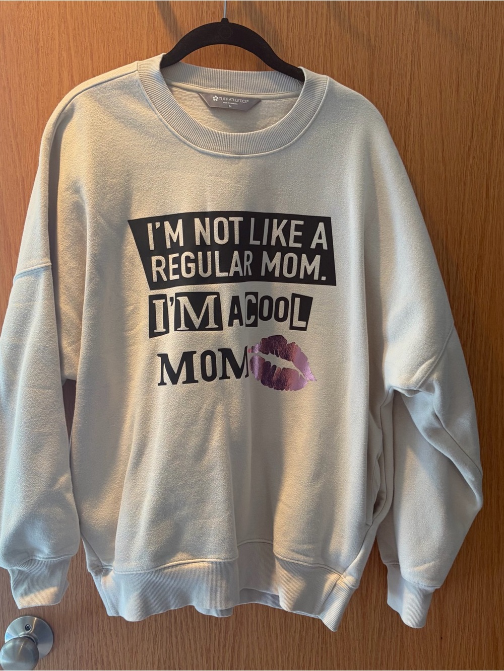Tuff Athletics Cream Crewneck with Bold Black Text and Purple Lip Graphic